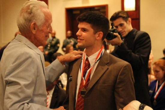 Veteran Bill Johnson speaking with PA student William Simpson