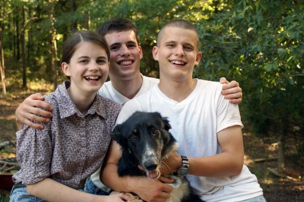 Abigail, Josiah, and Samuel with Georgia, the dog we adopted from the animal shelter.